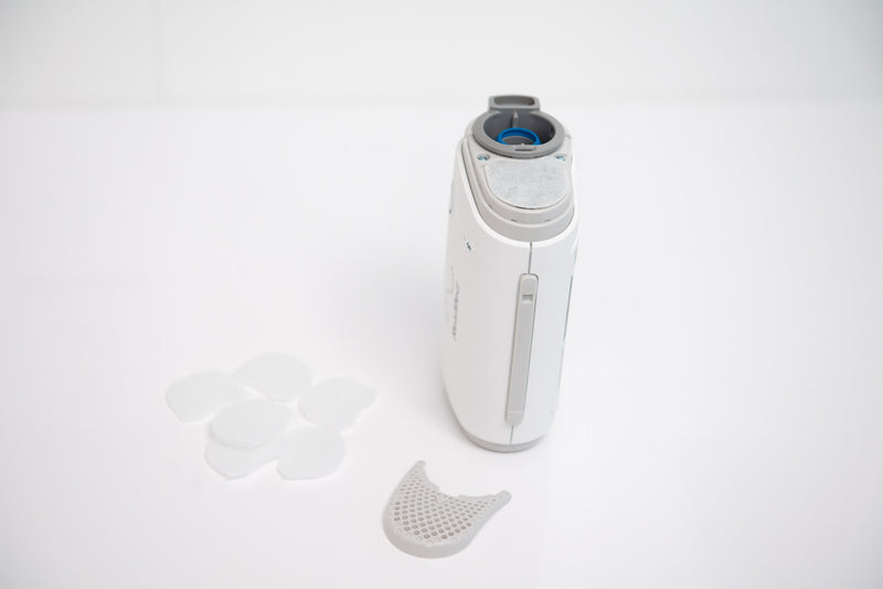 Airmini replacement filter displayed with the Airmini CPAP machine