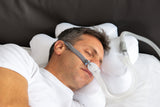 Side sleeping man resting on a CPAP pillow by Snugell that is covered with a cooling case by Snugell