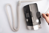 Premium Slim CPAP tubing by Snugell being connected into a CPAP machine