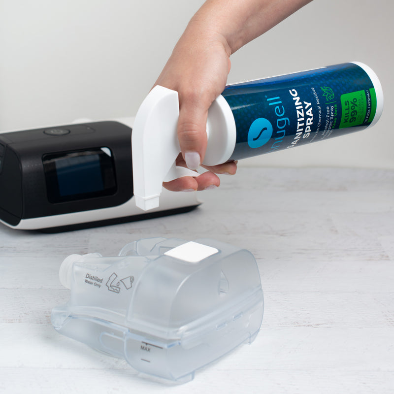 Snugell's CPAP Sanitizing Spray being used to sanitize a water chamber