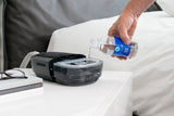 Distilled water being deposited into a CPAP water chamber from a 12oz distilled water bottle by Sngell