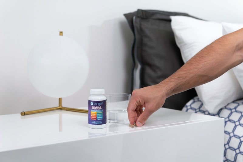 User about to take the correct dose of the Immune Defense Capsules by Snugell