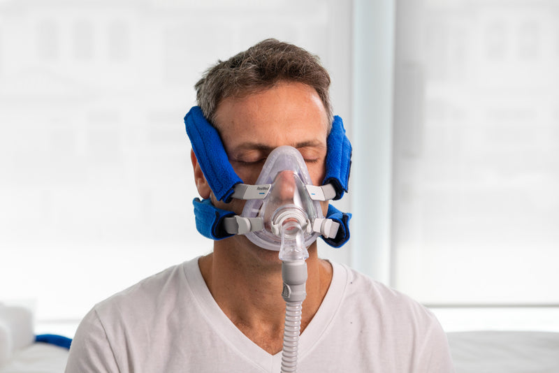 Front view of the Neckpad by Snugell  being used by a CPAP user