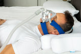 CPAP user utilizing the CPAP strap covers while sleeping